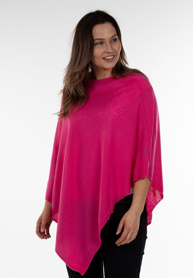 An image of model wearing Juolas Poncho in color pink