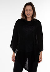 An image of model wearing Juolas Poncho in color black