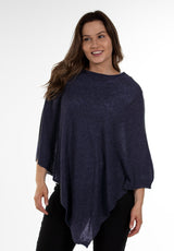 Image of model wearing Juolas Poncho in color dark blue