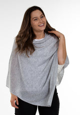 Close-up image of model wearing Juolas Poncho in color grey