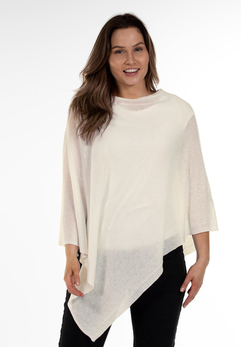 Closer image of model wearing Juolas Poncho in color white