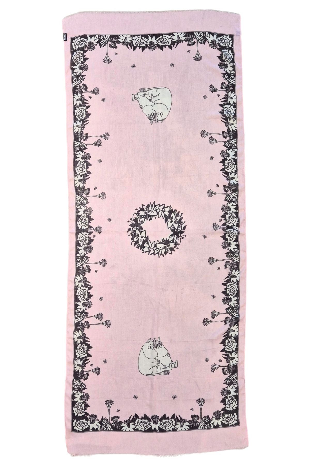 Vaalea roosa Muumi huivi Halaus kuosilla tasolla, kuvio näkyy